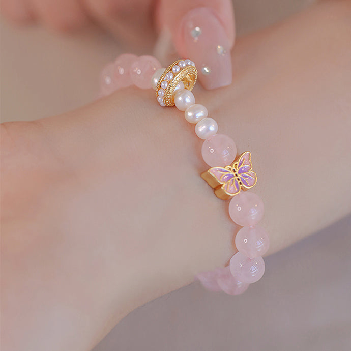 Peach Blossom Whispers - Butterfly and Pearl Charm Bracelet