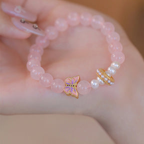 Peach Blossom Whispers - Butterfly and Pearl Charm Bracelet