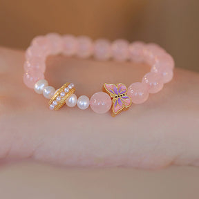 Peach Blossom Whispers - Butterfly and Pearl Charm Bracelet